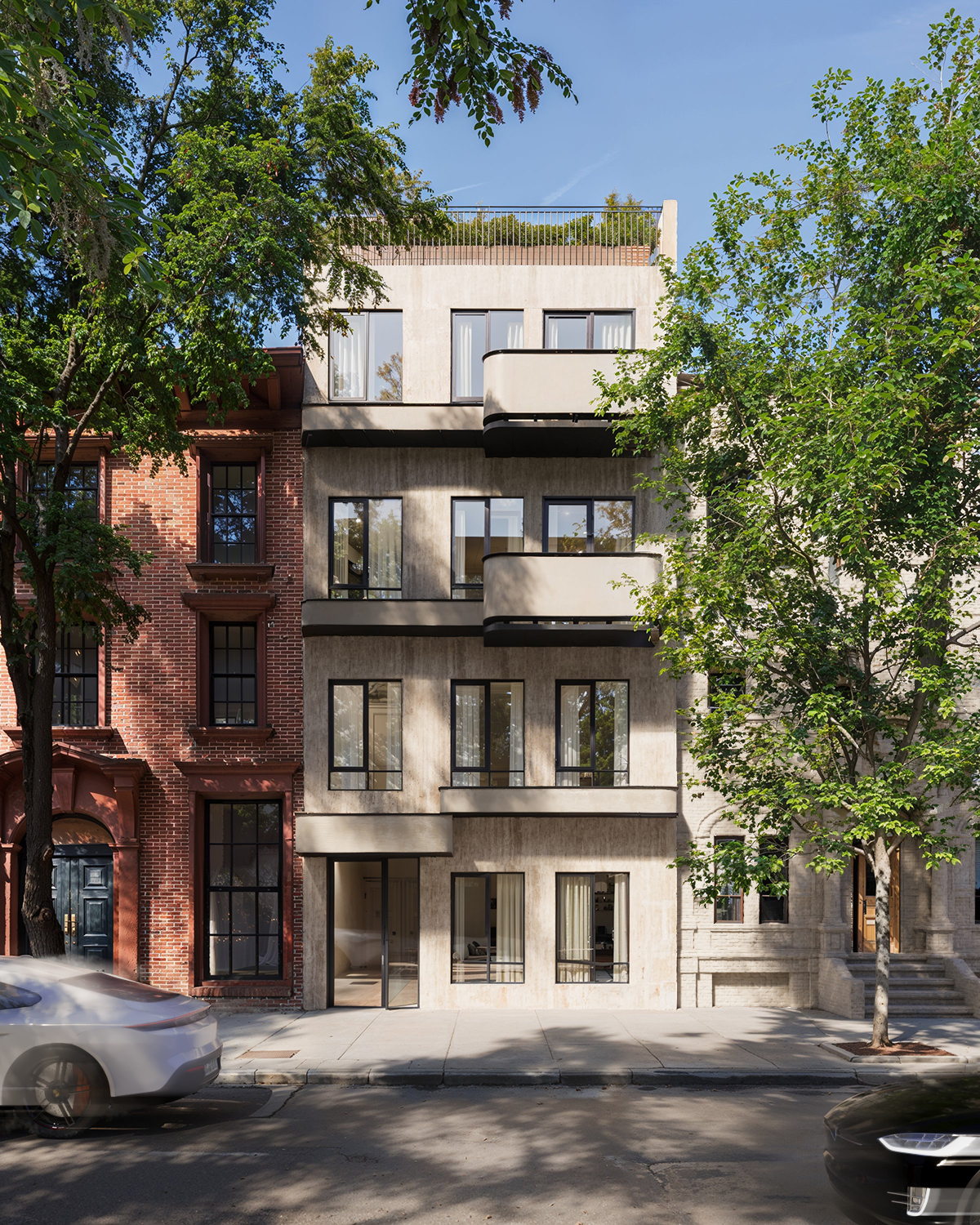 The travertine facade of 465 Hancock Street in Bedford-Stuyvesant